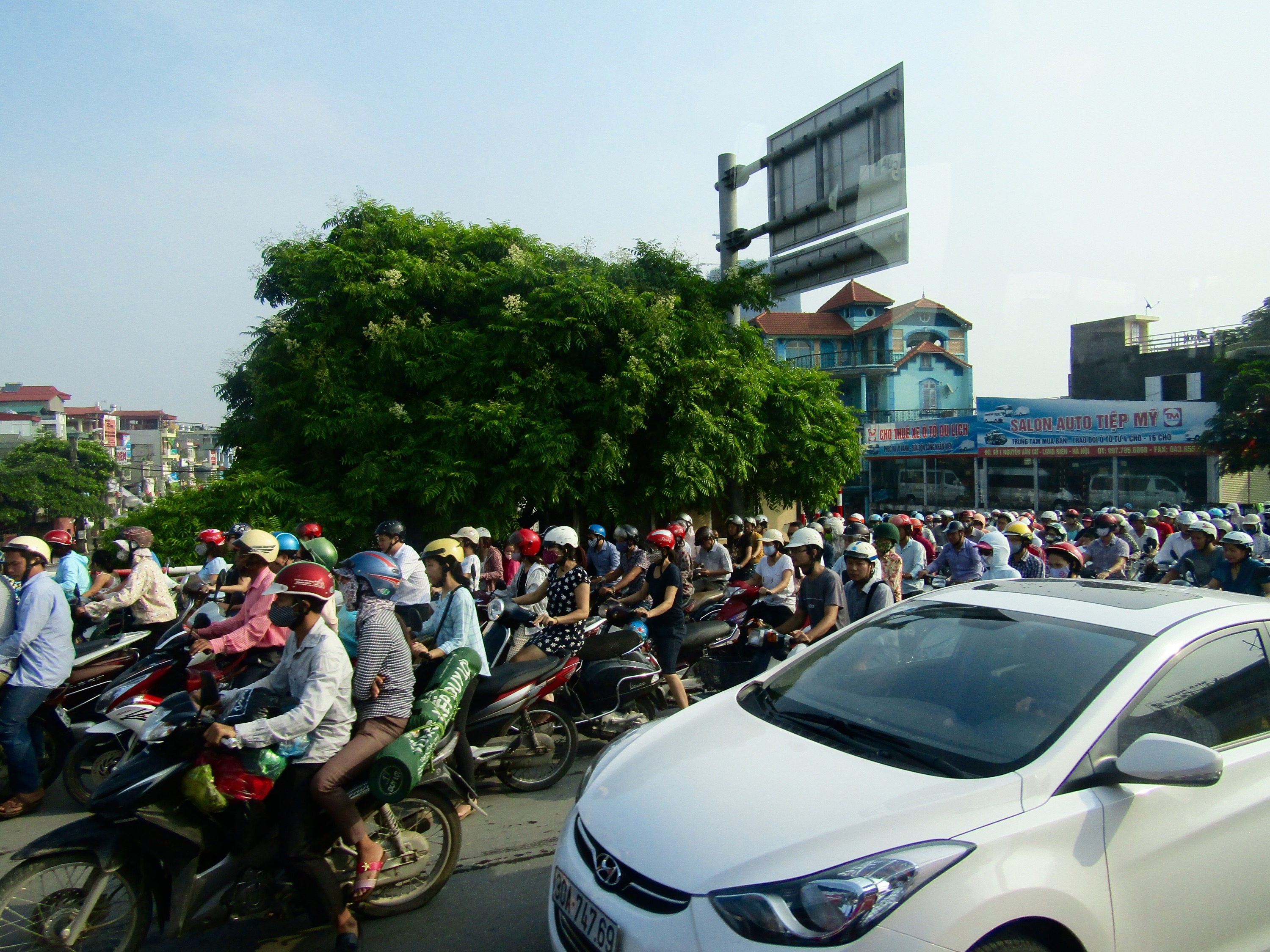 We left for Halong Bay during Hanoi's morning rush hour. High taxes on automobiles make scooters and motorbikes the preferred mode of transportation among the nearly 3 million Hanoians.