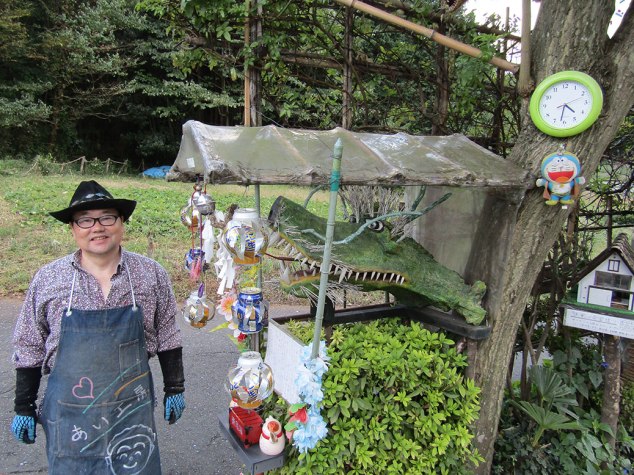 Kotiya-san, an artist with an eccentric style, came out to greet us along the path. He gave us one of his pinwheels made from old water bottles.
